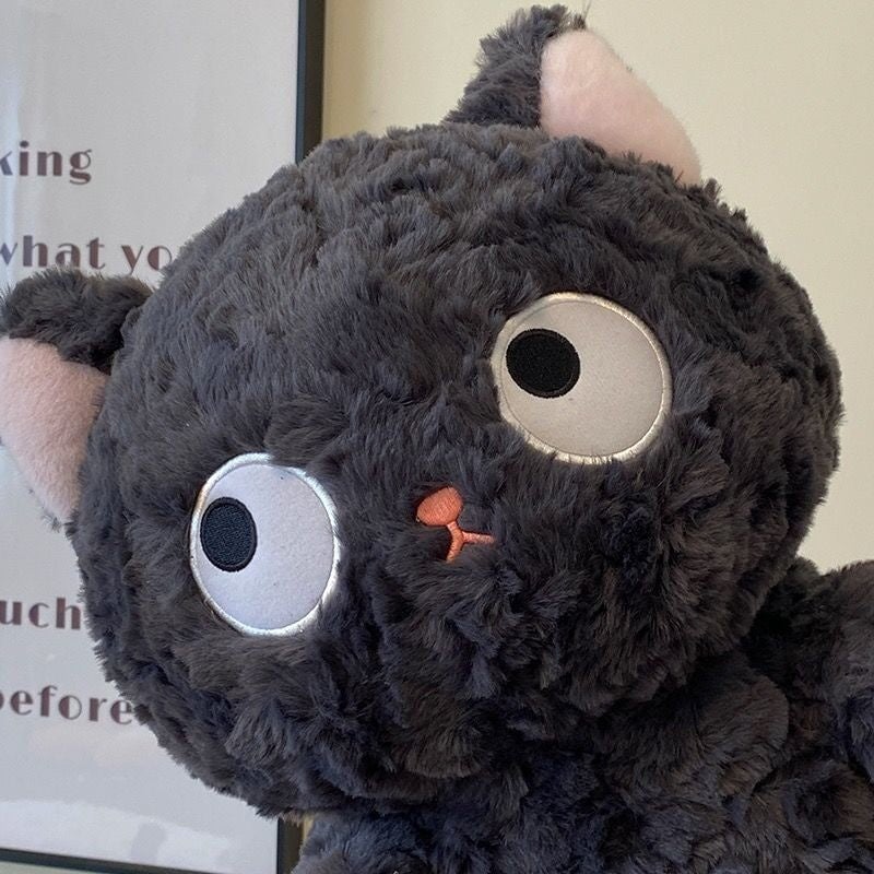 Jiji the Fluffy Black Cat Plushie Laying Down - Image 3