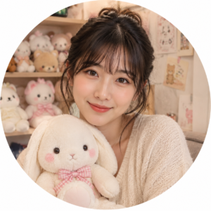 Mina Kurozawa, plush toy editor at My Kawaii Toys, holding a cute bunny plush in a cozy kawaii room